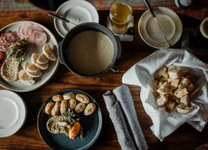 Appetizers on plates and utensils for dipping food