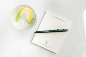 Wentworth Notepad and pen with a drink