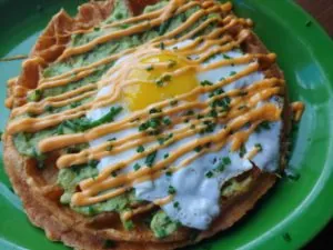 Avocado and egg on waffle