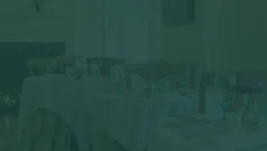 Green tinted photo of 1869 room tables and chairs