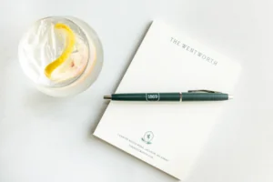 Wentworth Notepad and pen with a drink